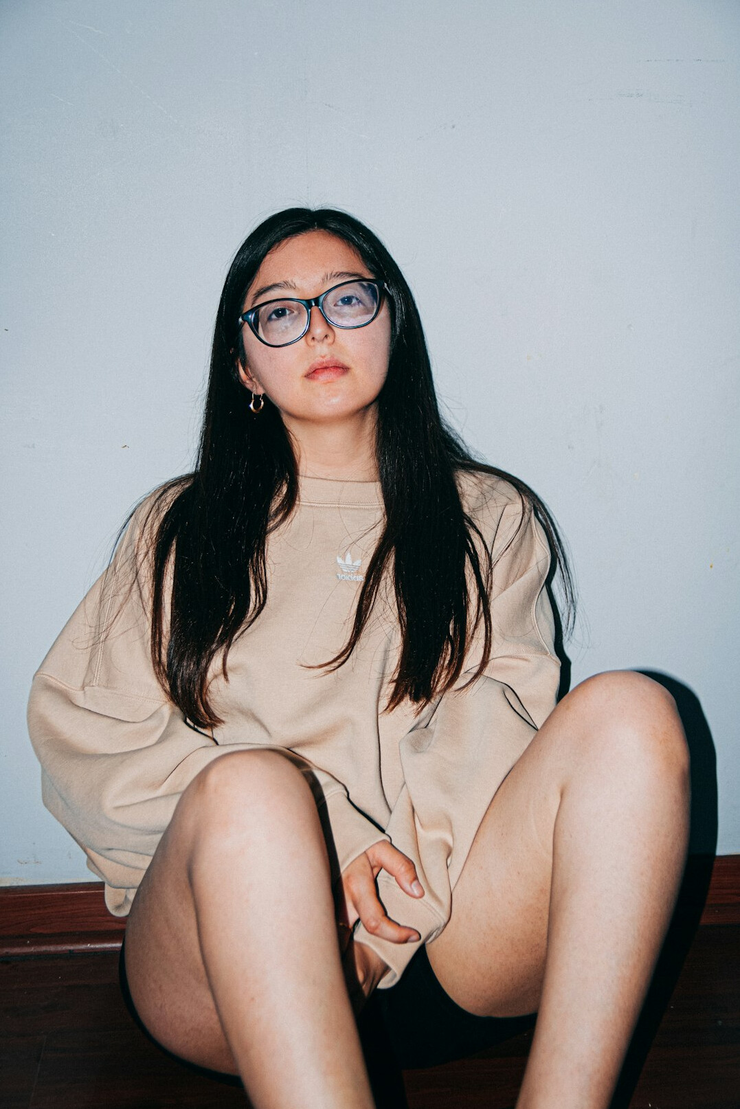 Studio portrait of a young woman with glasses
